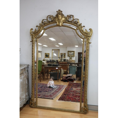 Most impressive and large antique French gilt framed mirror, with central mask to top, approx 222cm H x 137cm W