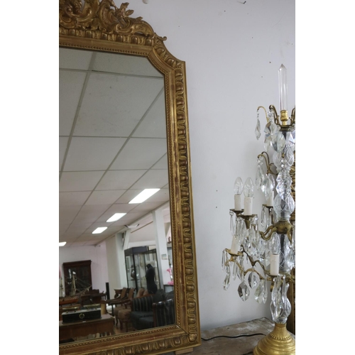 154 - Antique French gilt salon mirror, shaped edges, C scroll decoration to top, approx 142cm H x 89cm W