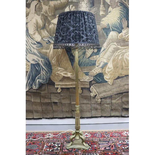 86 - Antique French cast brass standard lamp, the base standing on griffin support legs, well cast, unkno... 
