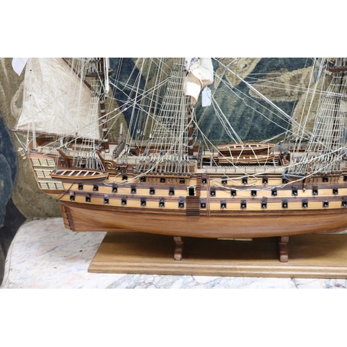 194 - HMS Victory model on stand, with plaque to base, well constructed, approx 85cm H x 107cm L