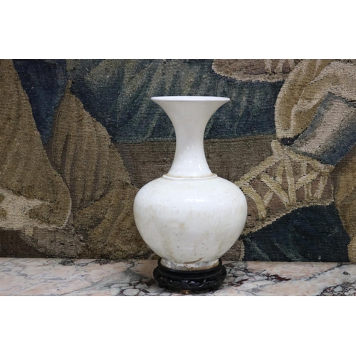173 - Chinese cream glazed bottle vase, Tang Dynasty, Ex George Brown Collection, Edinburgh and by descent... 
