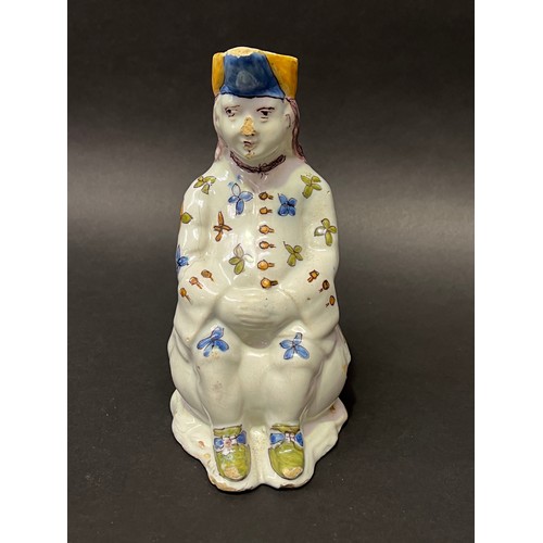 19 - Antique Faience seated figure jug, approx 22cm H