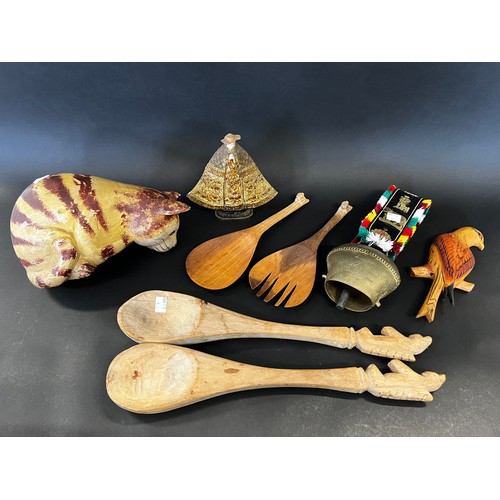 120 - Collection of mostly carved wood items, large spoons, solid carved cat, cow bell, etc