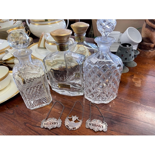 189 - Two cut crystal decanters, along with two Jonnie Walker bottles, & three decanters labels, one marke... 