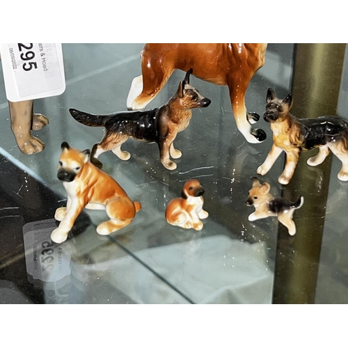 210 - A pack of dogs, to include two boxer dogs and others, some damages, approx 14cm H and smaller