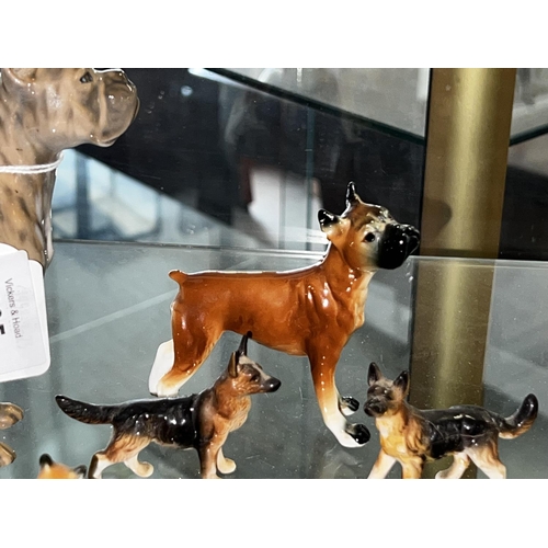 210 - A pack of dogs, to include two boxer dogs and others, some damages, approx 14cm H and smaller