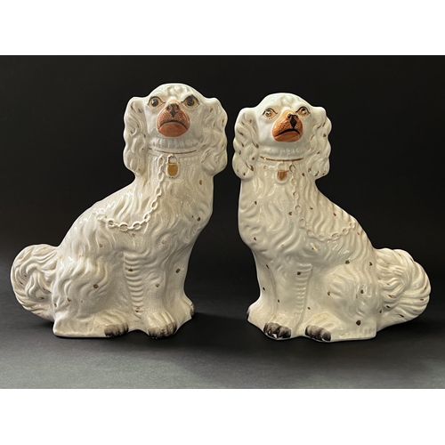 66 - Pair of Staffordshire dogs, approx 34cm H and smaller (2)