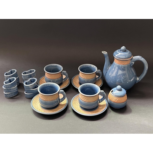 99 - Thailand teaset with sugar, four cups and saucers, napkin rings, approx 19cm H and shorter