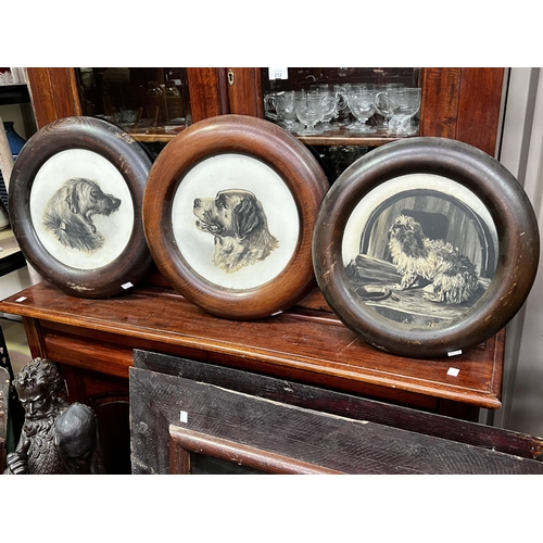 143 - Three antique milk glass painted dogs in circular frames, frame approx 41cm Dia  (3)