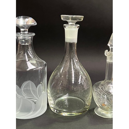 243 - Four decanters, approx 26cm H and shorter