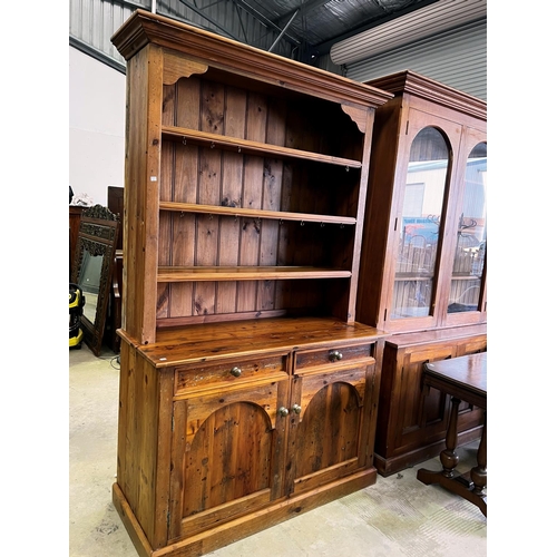 263 - Rustic recycled pine two height open shelf top dresser, fitted with two drawers and two doors below,... 