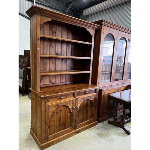 263 - Rustic recycled pine two height open shelf top dresser, fitted with two drawers and two doors below,... 