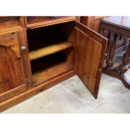 263 - Rustic recycled pine two height open shelf top dresser, fitted with two drawers and two doors below,... 