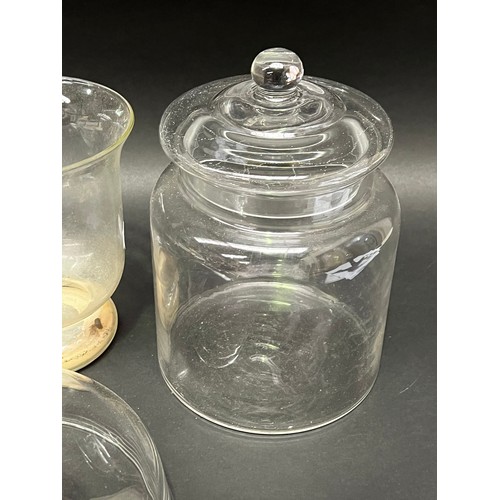 125 - Glass lolly jar, cover, candle hold and a vase (4)