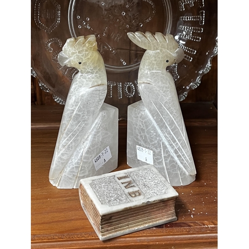 275 - Pair of cockatoo bookends and a book paperweight, approx 15cm H and shorter