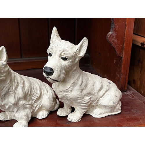 281 - Pair of spelter Scottie dogs, approx 18cm H x 20cm W and shorter (2)