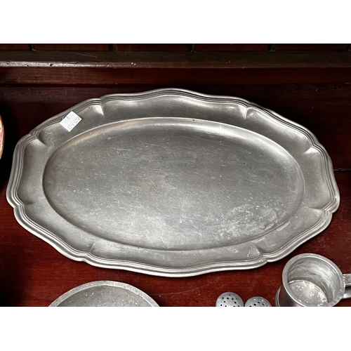 282 - Assortment of pewter, to include: a platter, pair of salt & peppers, tankard etc, approx 37cm W and ... 