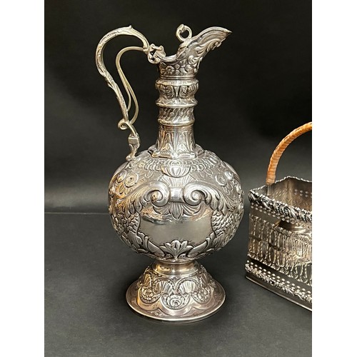 84 - Good quality Barker & Ellis silver plate wine cradle, along with a repousse silver plate claret jug ... 