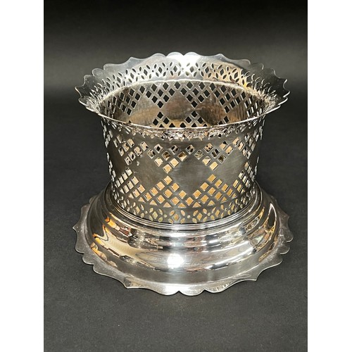 84 - Good quality Barker & Ellis silver plate wine cradle, along with a repousse silver plate claret jug ... 