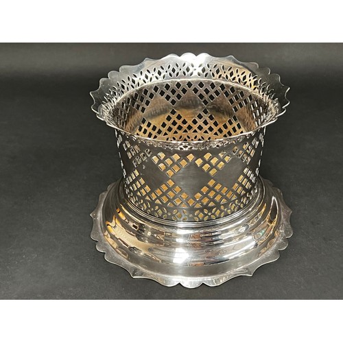 84 - Good quality Barker & Ellis silver plate wine cradle, along with a repousse silver plate claret jug ... 