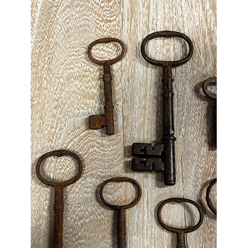 25 - Assortment of large antique iron keys