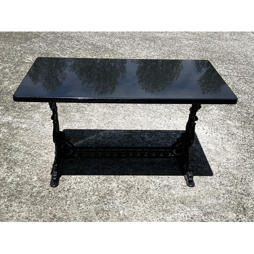 39 - Antique cast iron support marble topped garden table, approx 70cm H x 110cm W x 60cm D