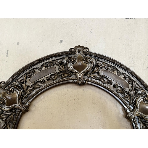 77 - Antique bronze pierced circular frame, approx 56cm Dia