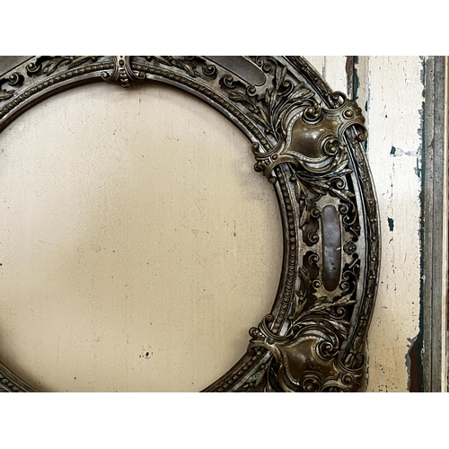 77 - Antique bronze pierced circular frame, approx 56cm Dia