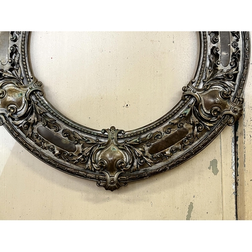 77 - Antique bronze pierced circular frame, approx 56cm Dia