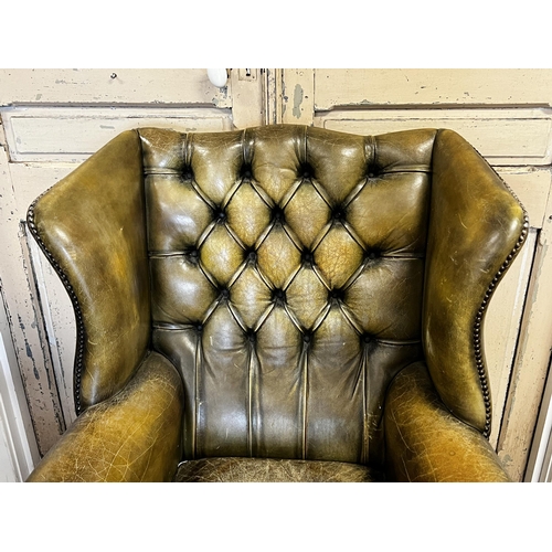 78 - English Georgian revival green leather wing arm chair