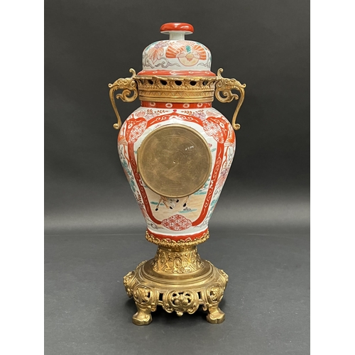 92 - Antique French eight day movement, mounted in a lidded antique oriental vase, unknown working condit... 