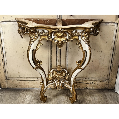 57 - Antique 19th century French marble topped console, painted and gilt gesso highlighted frame, with wh... 