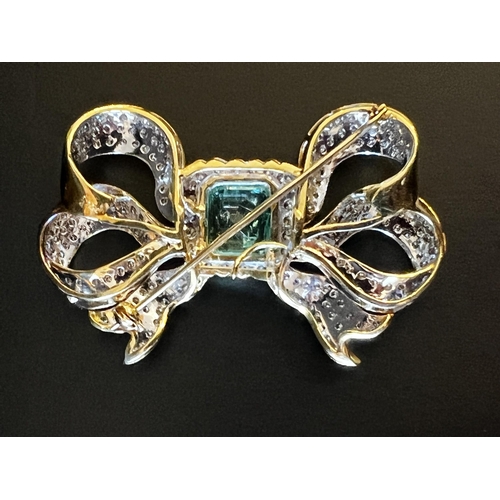 123 - Fine 18ct white gold and yellow gold emerald and diamond bow brooch, Colombian emerald bezel set at ... 