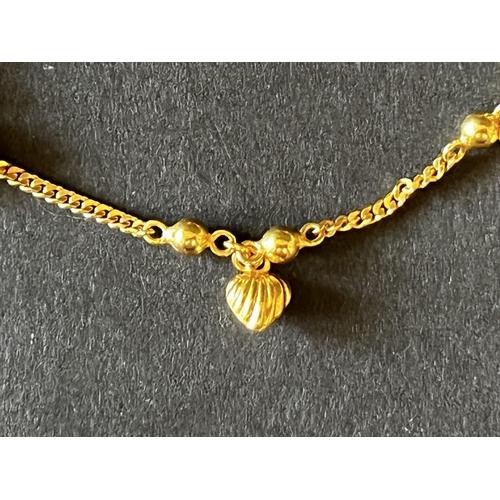 151 - 18kt Italian Gold child's charm bracelet, approx 18cm long and approx 5 grams.