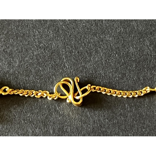 151 - 18kt Italian Gold child's charm bracelet, approx 18cm long and approx 5 grams.