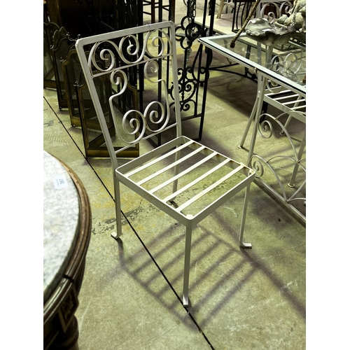 136 - Vintage iron white painted patio suite, comprising a glass topped table and four chairs table, appro... 