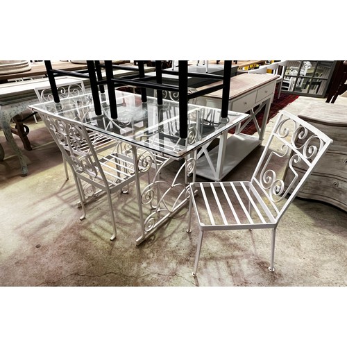 136 - Vintage iron white painted patio suite, comprising a glass topped table and four chairs table, appro... 