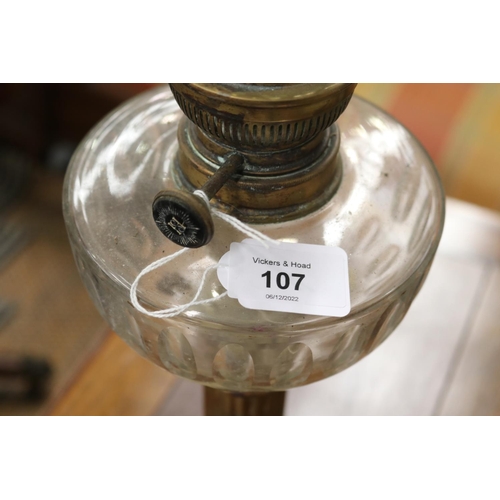 107 - Antique French oil lamp, with clear glass reservoir, approx 37cm H