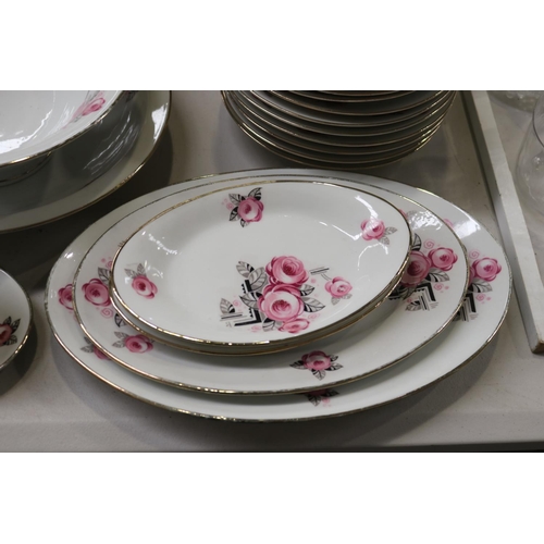 180 - Extensive French Art Deco porcelain dinner service decorated with pink and black flowers