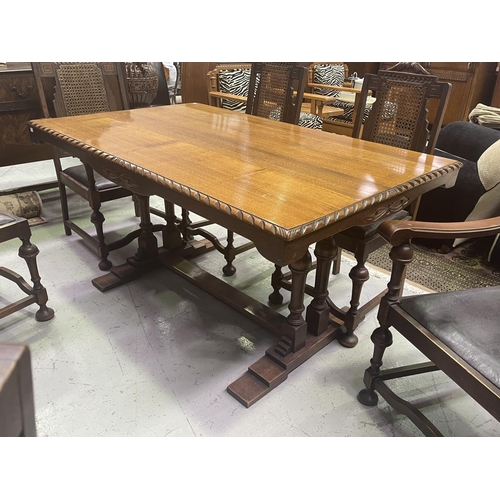 220 - Jacobean revival period oak dining suite, comprising a table and six chairs, chairs with angular can... 