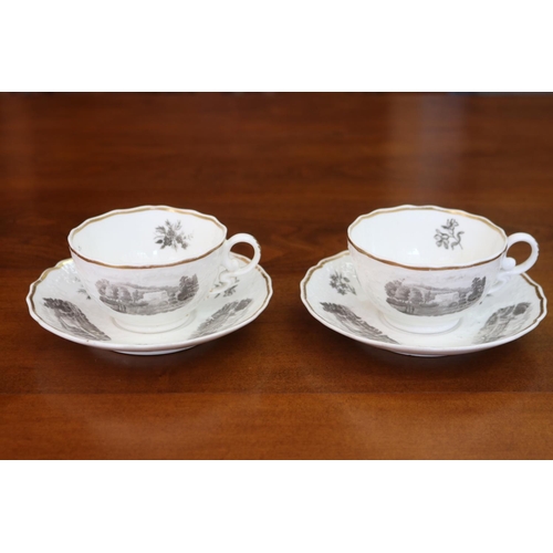 95 - Pair of antique porcelain cups & saucers, decorated with panelled scenes to either side, unmarked bu... 