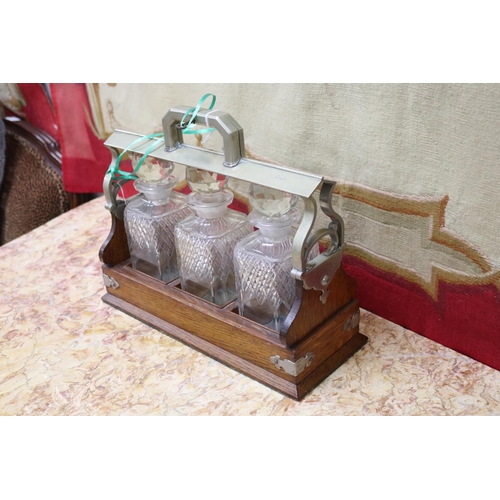 119 - Antique three bottle tantalus, approx 28cm H x 34cm W x 13cm D