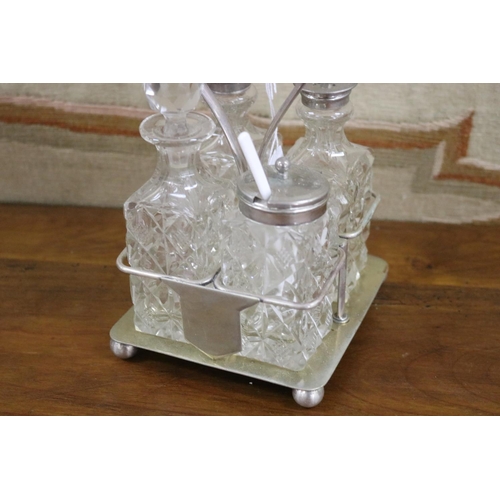 28 - EPNS four bottle cruet stand, approx 19cm H x 12cm W x 13cm D