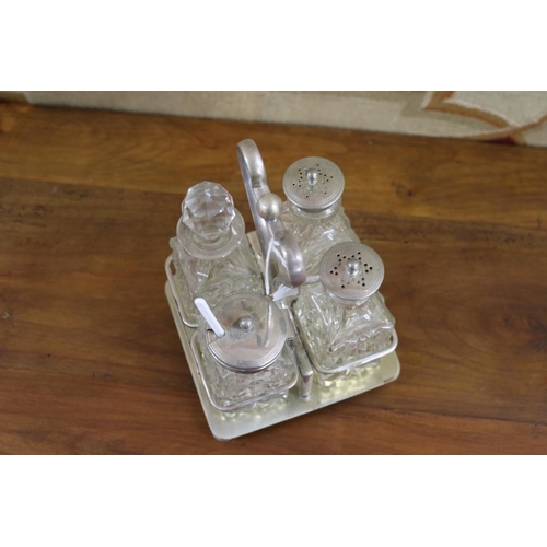 28 - EPNS four bottle cruet stand, approx 19cm H x 12cm W x 13cm D