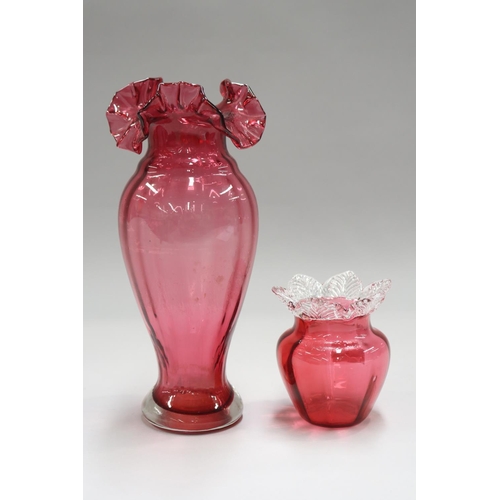 63 - Two cranberry glass vases, approx 28cm H and shorter (2)