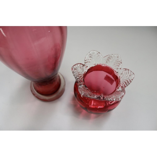 63 - Two cranberry glass vases, approx 28cm H and shorter (2)