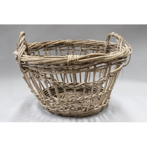 89 - Rustic twin handled basket, approx 37cm H (ex handles) x 61cm W x 56cm D