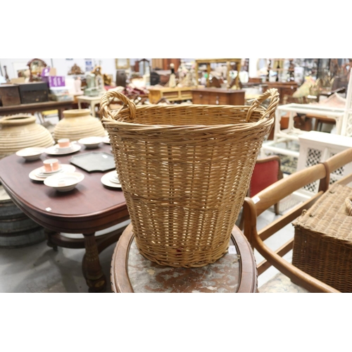 272 - Twin handled cane basket, approx 37cm H ex handles x 43cm W x 33cm D