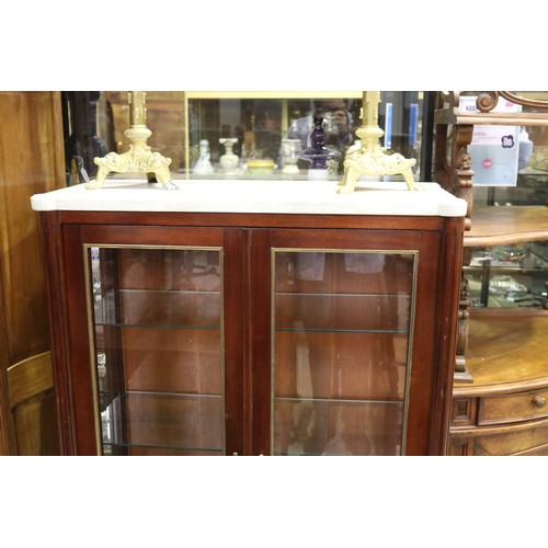1118 - Good quality French Louis XVI style two door showcase, with white marble top, and brass mounted trim... 