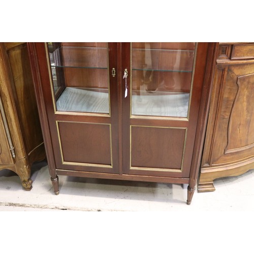 1118 - Good quality French Louis XVI style two door showcase, with white marble top, and brass mounted trim... 